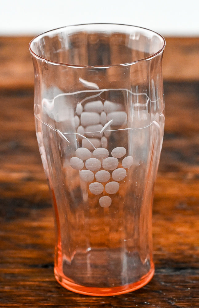 pink glass tumbler with etched grapes