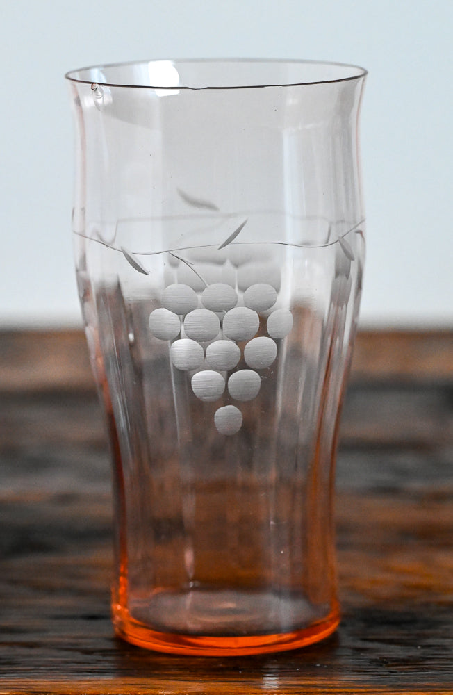 pink glass tumbler with etched grapes