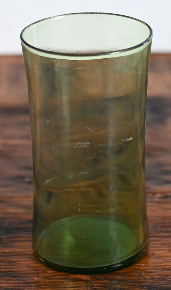 green curved tumbler glass