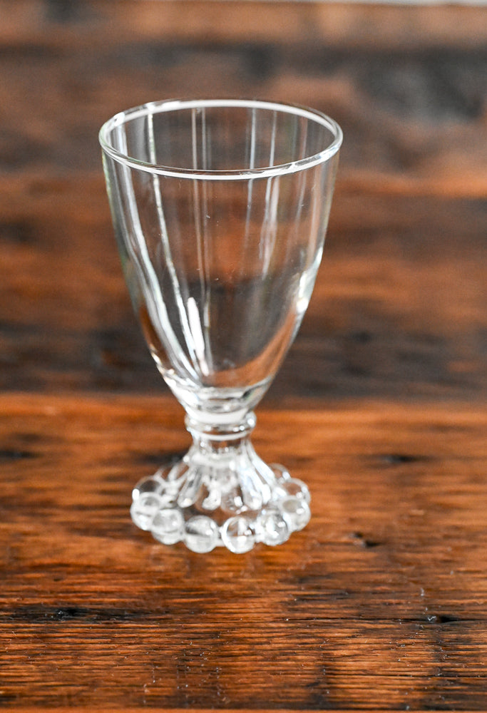 Anchor Hocking Boopie clear glass with balls on bottom of stem