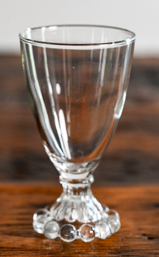 Anchor Hocking Boopie clear glass with balls on bottom of stem