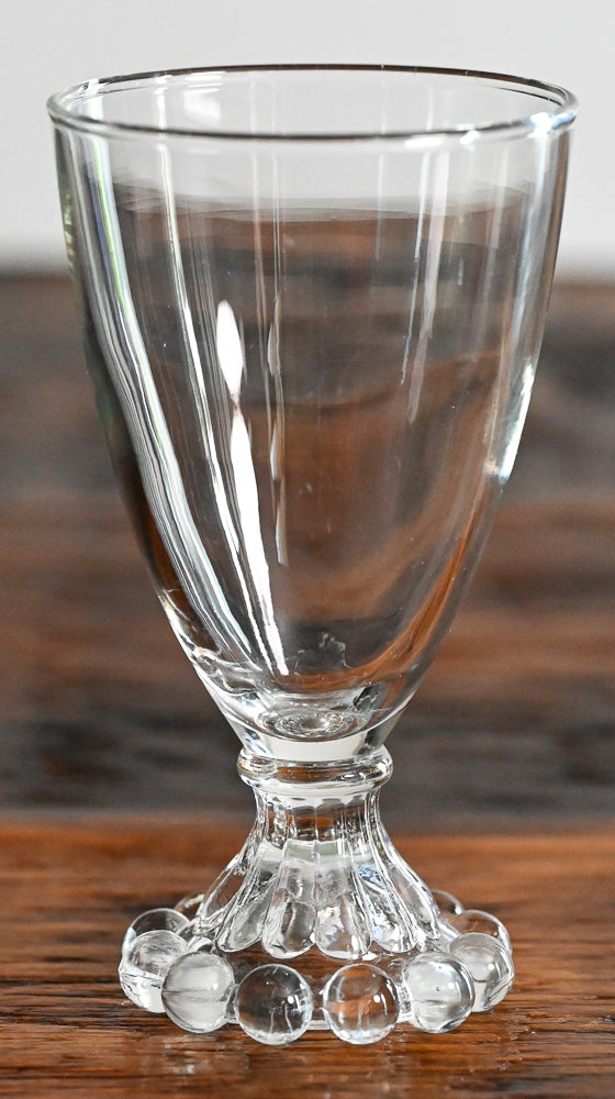 Anchor Hocking Boopie clear glass with balls on bottom of stem