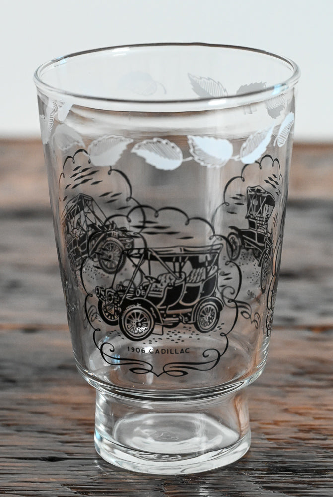 tumbler with white leaves and black cars