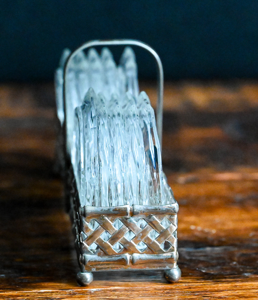 clear glass coasters in metal carrier