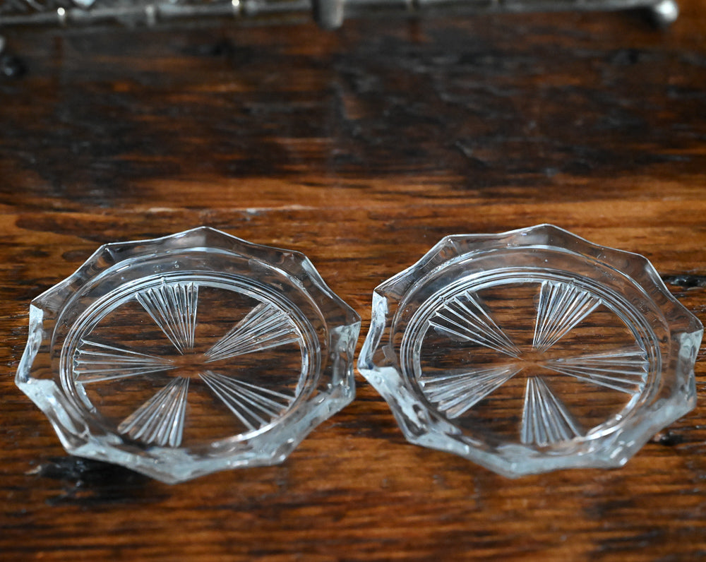 clear glass coasters in metal carrier