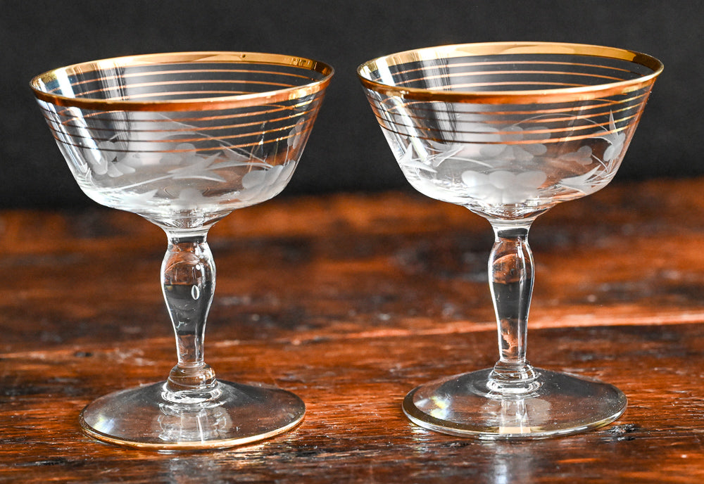 gold rim and gold striped flower etched cocktail coupes