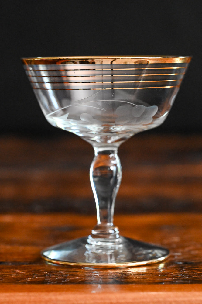 gold rim and gold striped flower etched cocktail coupes