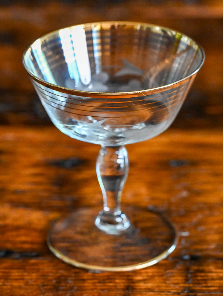 gold rim and gold striped flower etched cocktail coupes