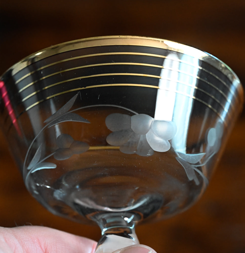 gold rim and gold striped flower etched cocktail coupes