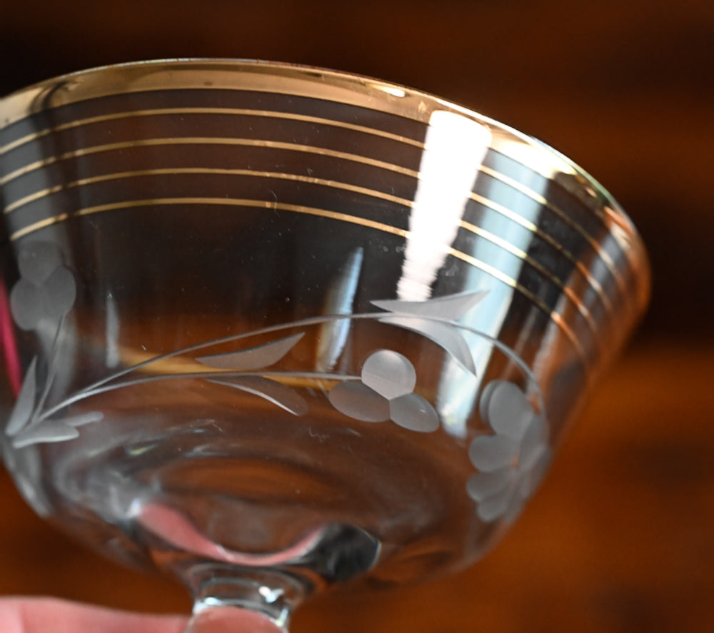 gold rim and gold striped flower etched cocktail coupes