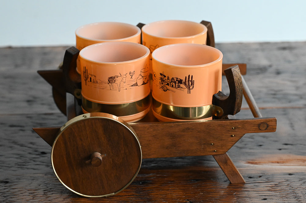orange western scene mugs on wooden cart