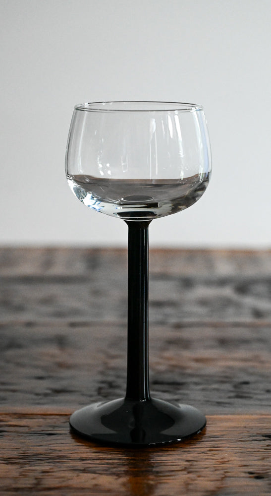 clear glass with black stem and foot