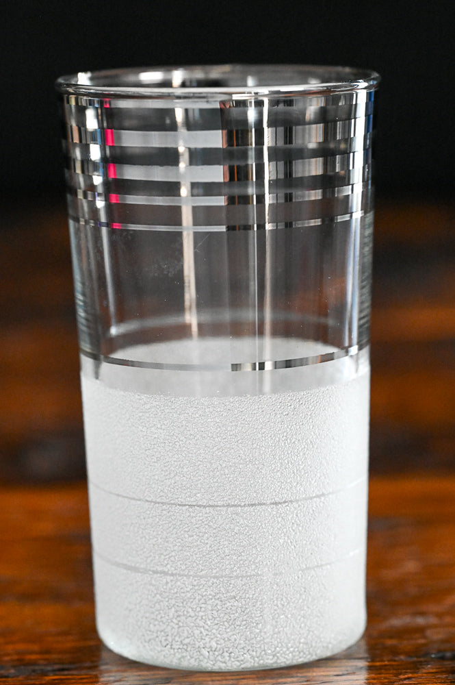 silver banded and frosted tumbler glass