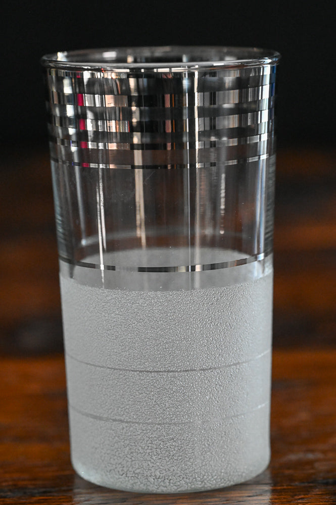 silver banded and frosted tumbler glass