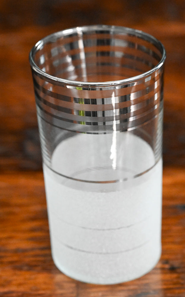 silver banded and frosted tumbler glass