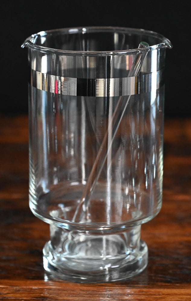 silver banded cocktail pitcher, glass cocktail stirrer and 6 silver rim roly poly glasses