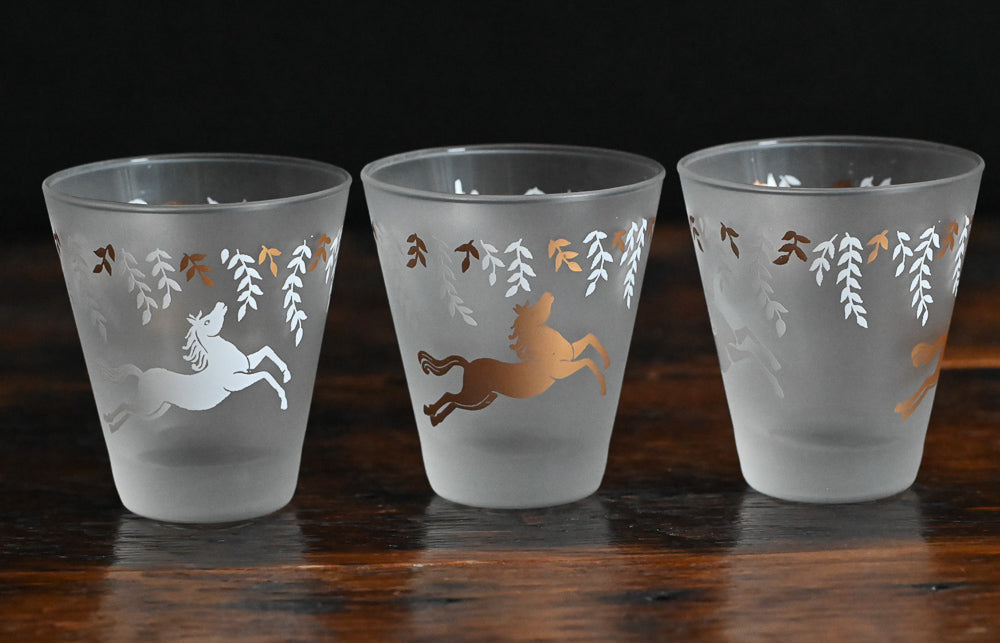 White and gold horses and leaves on frosted lowball glasses