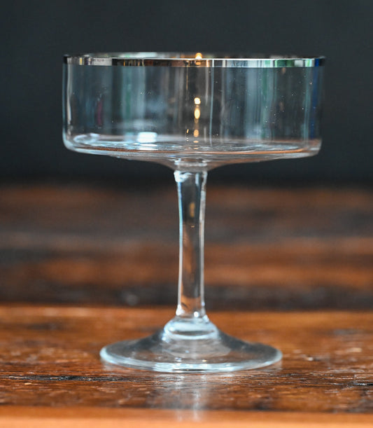 silver rimmed flat bottomed cocktail coupes