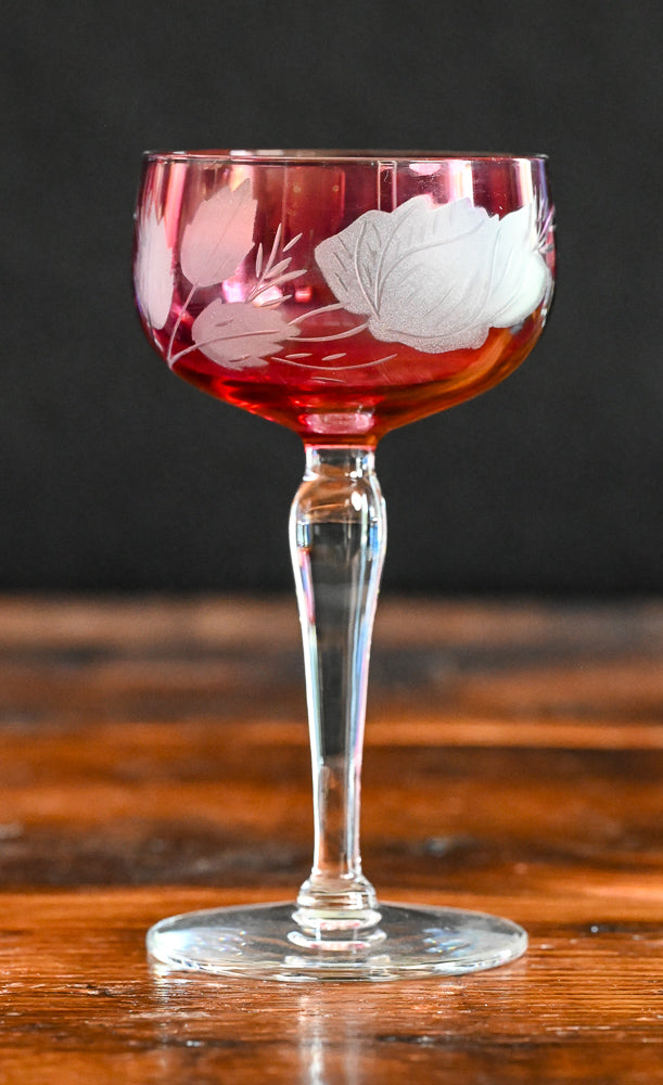 cranberry cocktail coupes with white frosted leaves