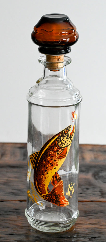 Cabin Still 1960s decanter with trout on bottle, brown glass stopper