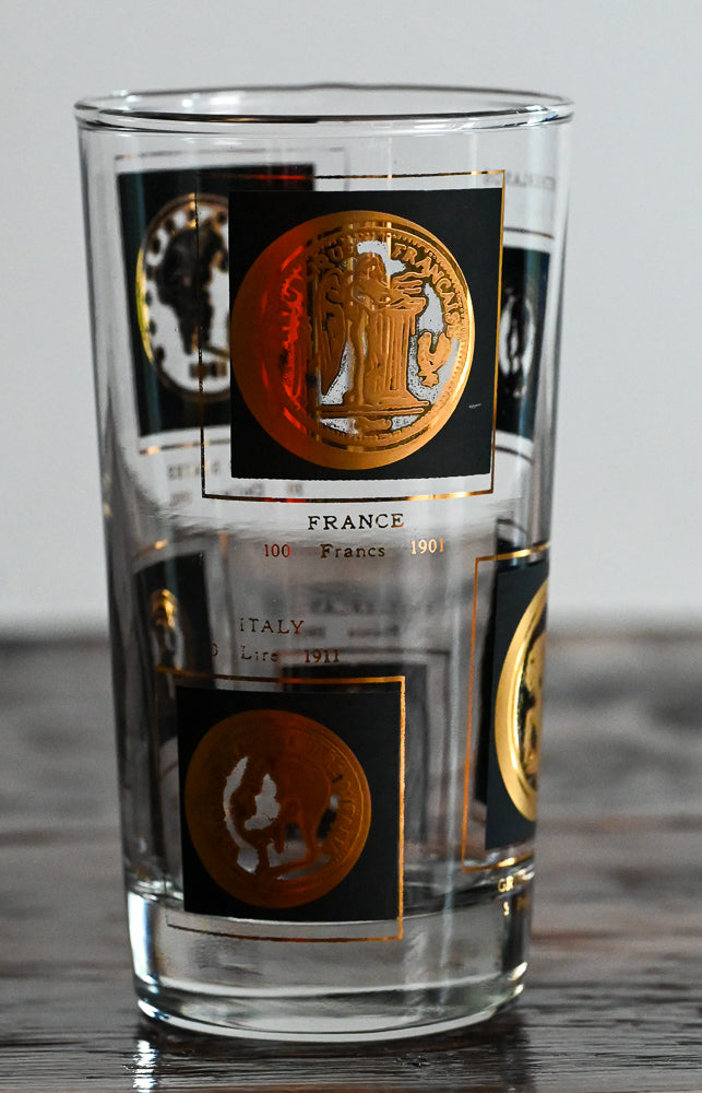 gold coin and black accented highball glass 