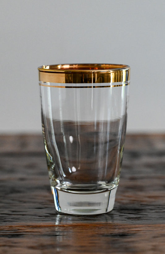 tall glass with gold rim