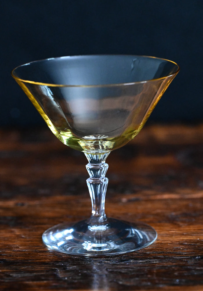 yellow champagne coupe with clear stem