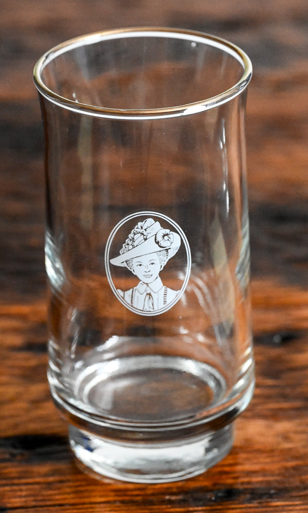 lady in white in circle logo on white tumblers