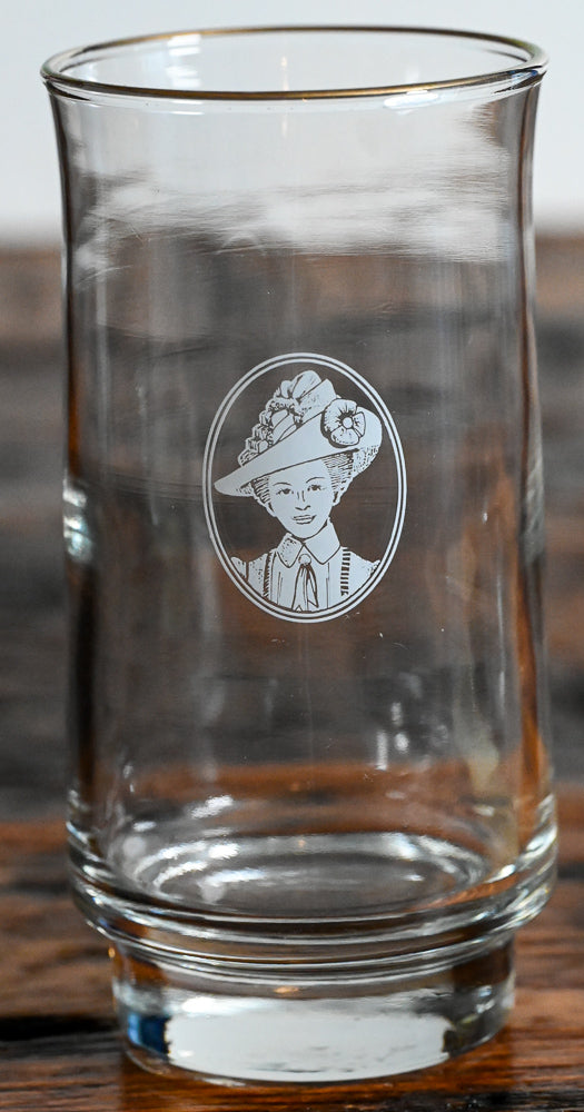 lady in white in circle logo on white tumblers