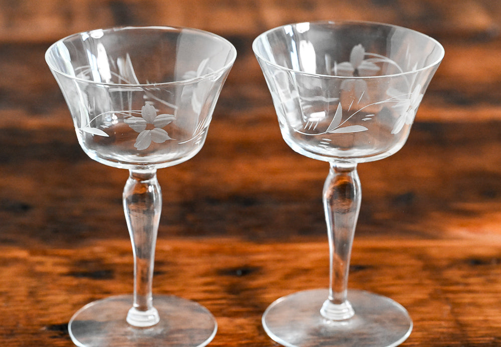 floral etched coupes on wood table