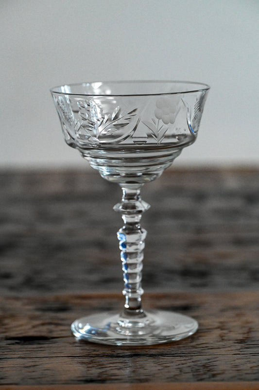 floral etched coupe on wood table