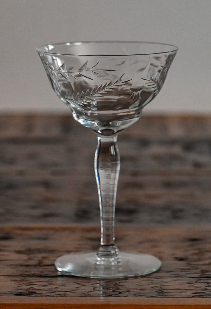 floral etched coupe on wood table