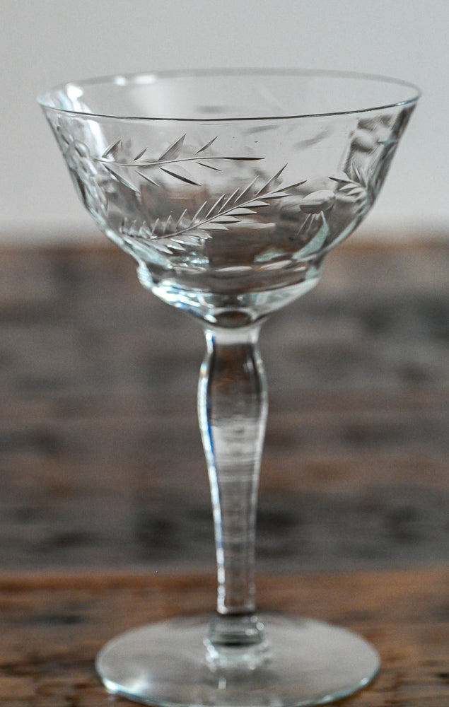 floral etched coupe on wood table