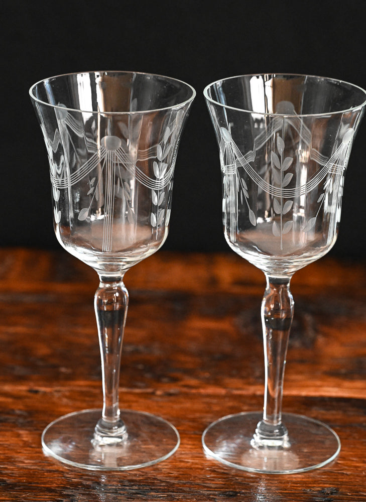 banner and floral etched wine goblets