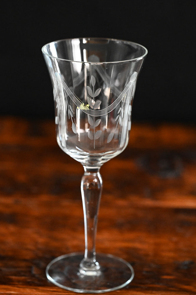 banner and floral etched wine goblets