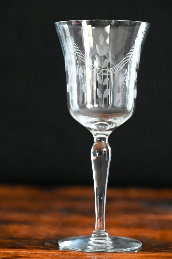 banner and floral etched wine goblets