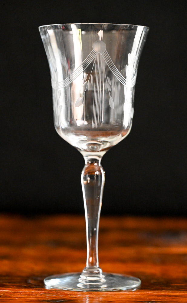 banner and floral etched wine goblets