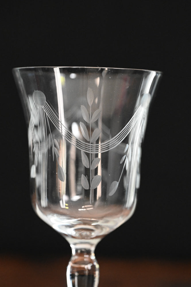 banner and floral etched wine goblets