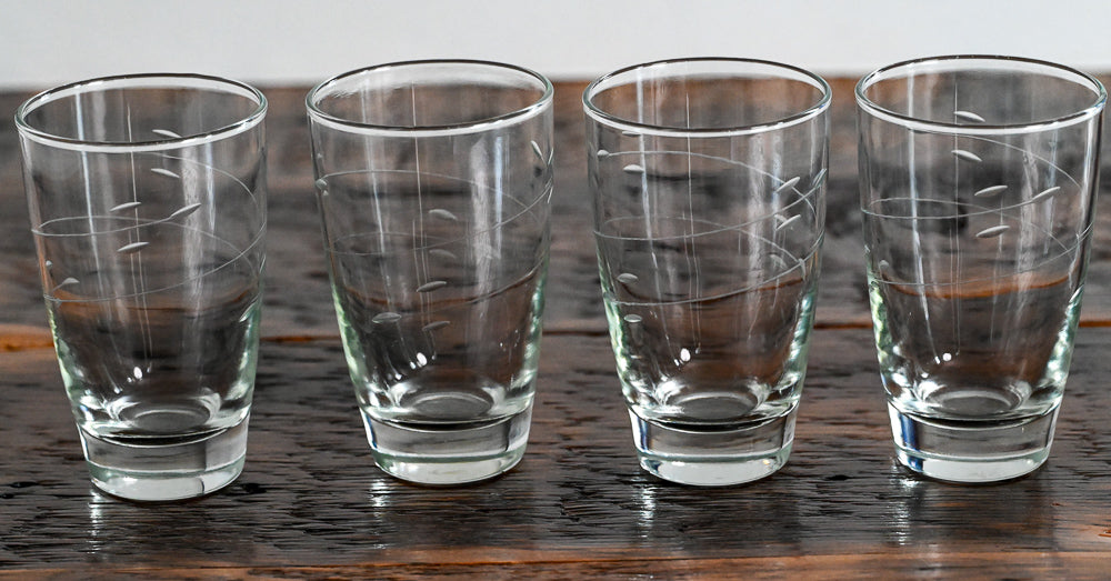 etched tumblers on wood table