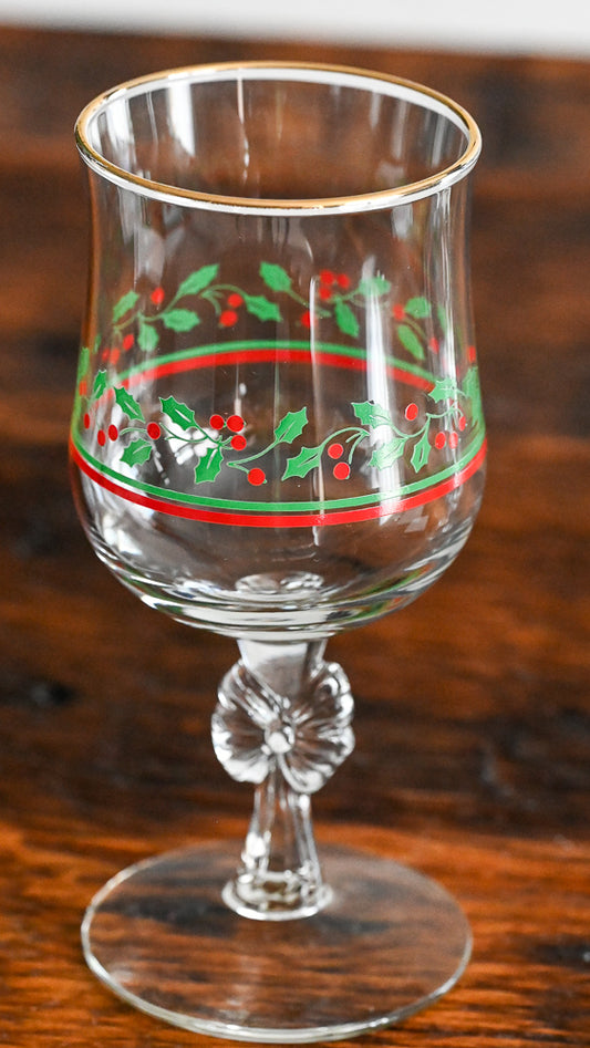 Libbey goblet with bow stem, green and red holly print, gold rim