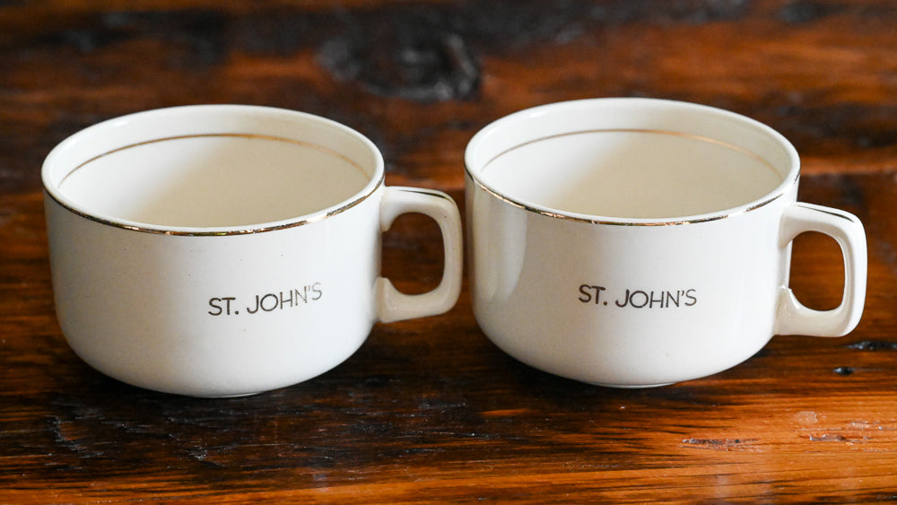 beige mugs with St John's in gold with gold rims