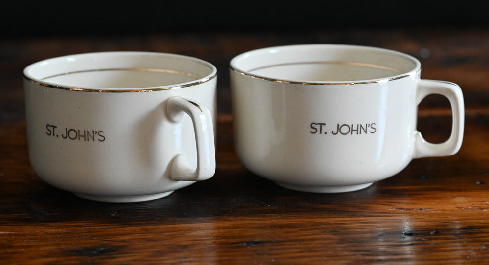 beige mugs with St John's in gold with gold rims