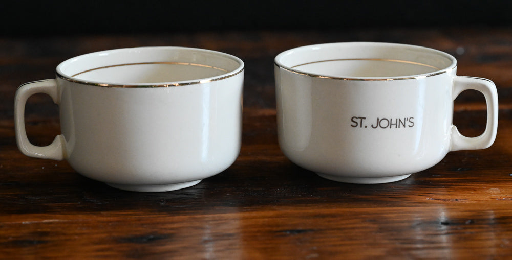 beige mugs with St John's in gold with gold rims