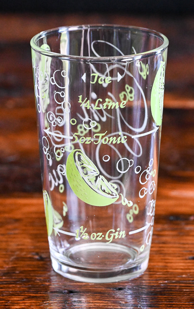 Gin and Tonic tumblers with recipe and sliced limes in green and white