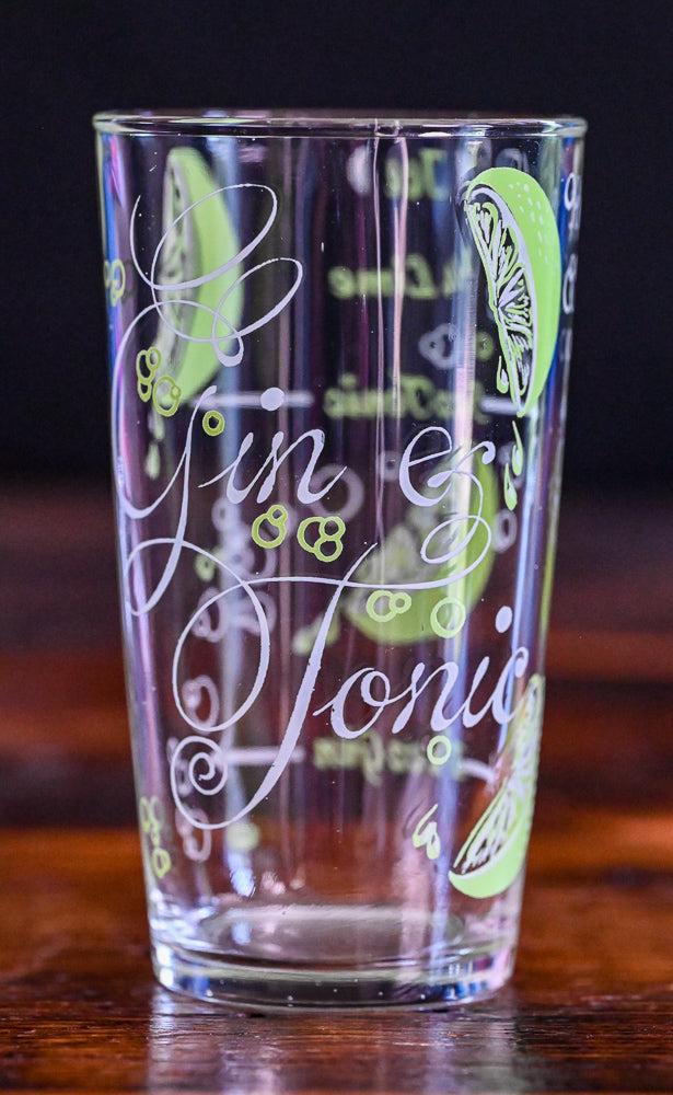 Gin and Tonic tumblers with recipe and sliced limes in green and white