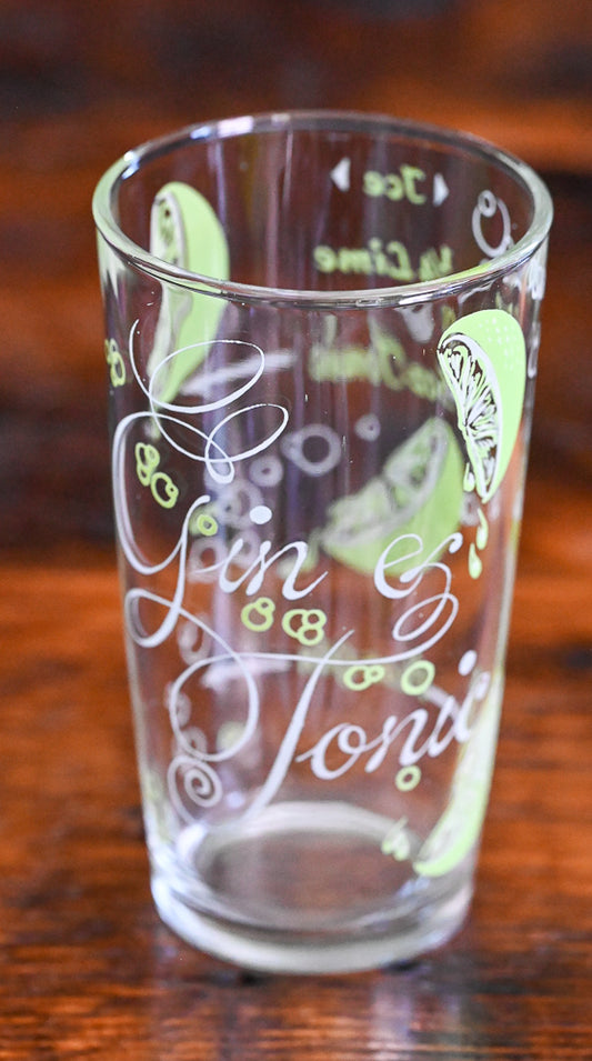 Gin and Tonic tumblers with recipe and sliced limes in green and white