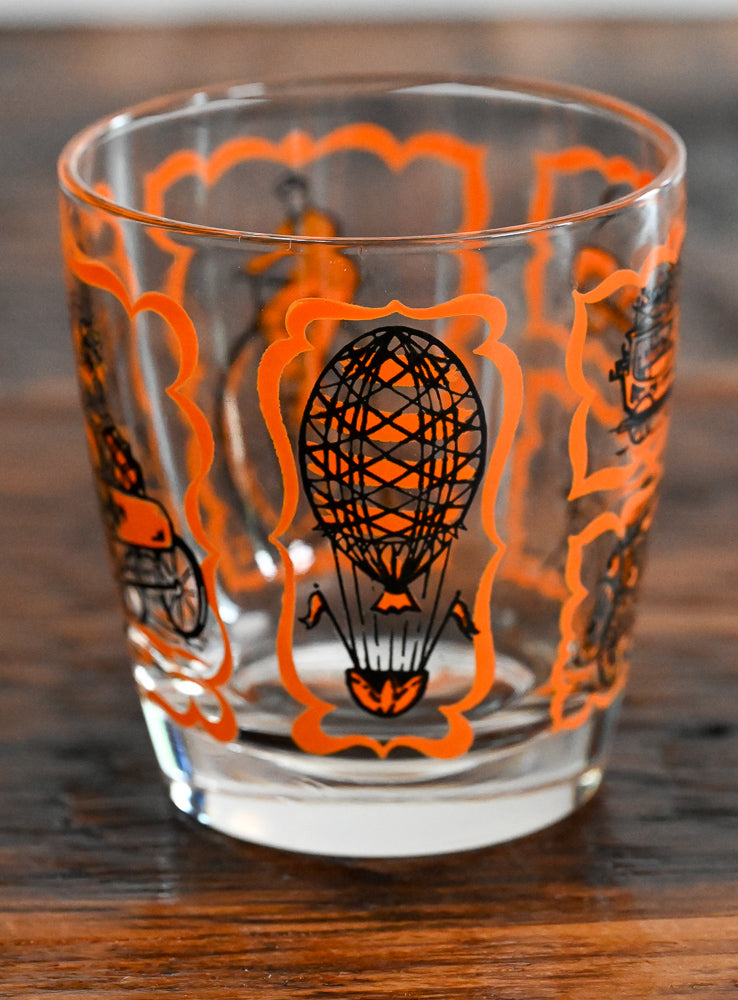 orange and black transportation print lowball glass