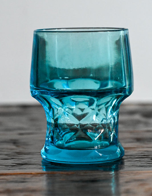Blue tumbler on wooden table