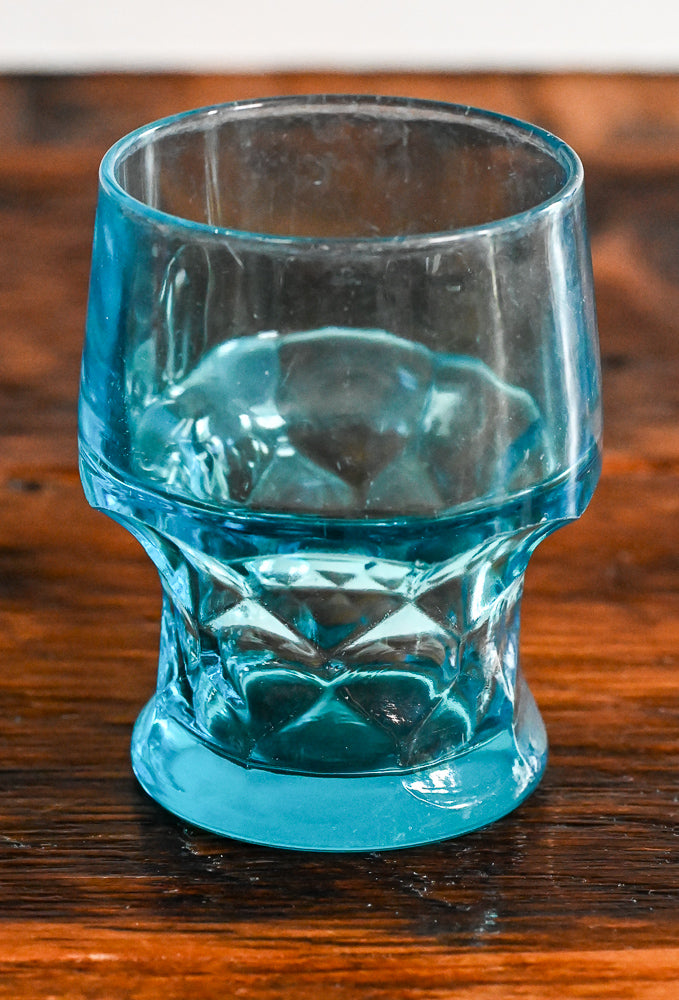 Blue tumbler on wooden table