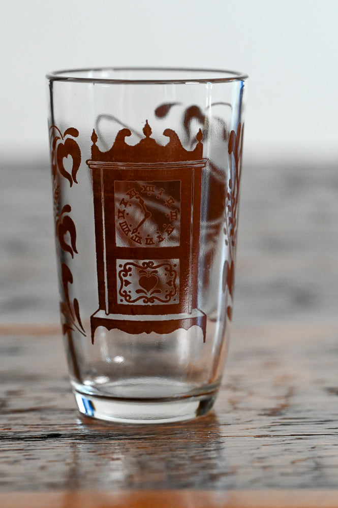 brown clock print juice glass